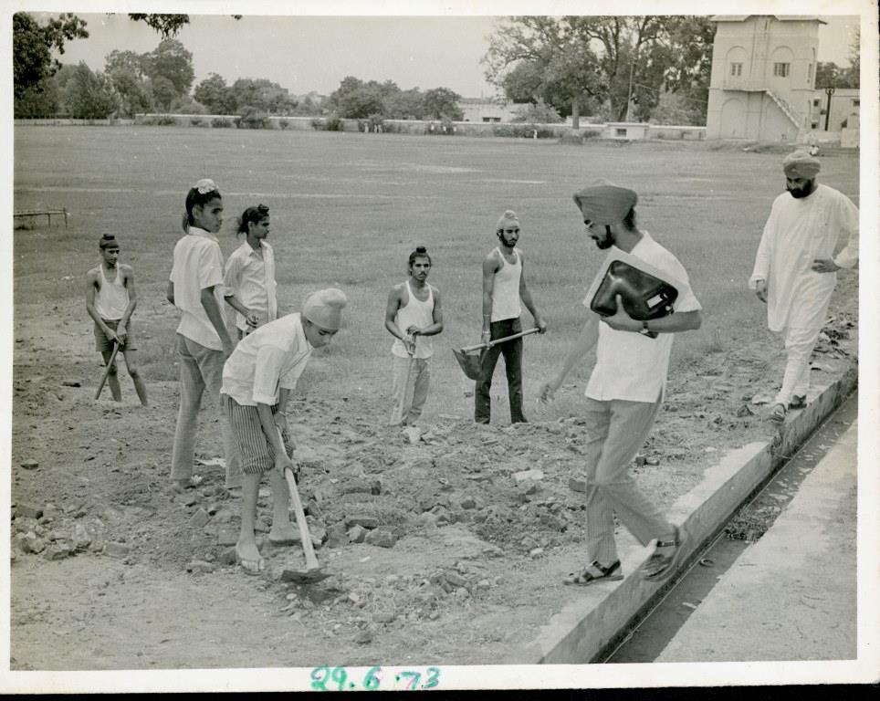 Jasbir Singh Kang Performing Community Service (Foreground with Shovel), National Social Service Summer Camp, Punjab, 1973. Courtesy of the Kang Family.