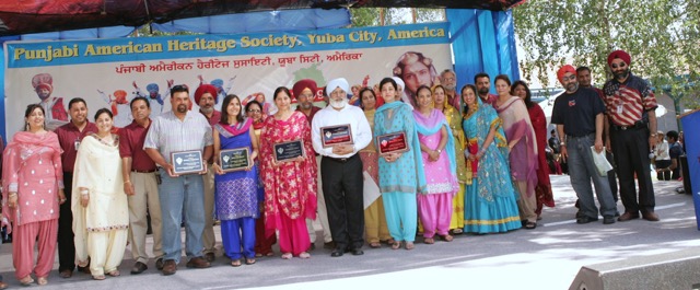 Punjabi American Heritage Society Members Honoring Different Personalities For Their Community Service, Punjabi American Festival. Courtesy of the Punjabi American Heritage Society.