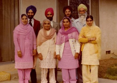 The Grewal family, back row (left to right) Manohar, Harjit, Kuldip, and Ranjit and front row (left to right) Gurdial, Sant, Swarn, and Joginder, Yuba City, need year.jpg